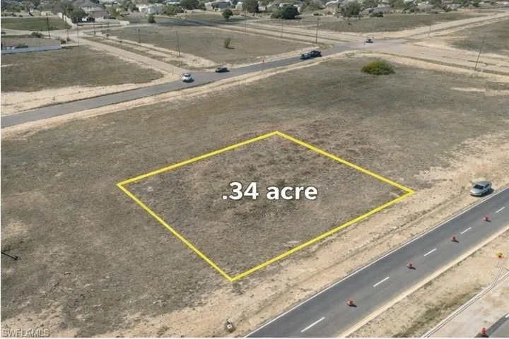 Aerial view of residential area with property boundaries highlighted