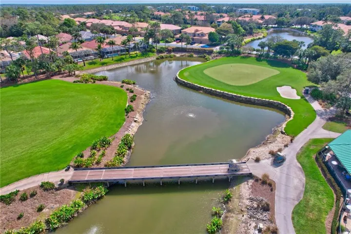 Bird's eye view featuring view of golf course and a water view