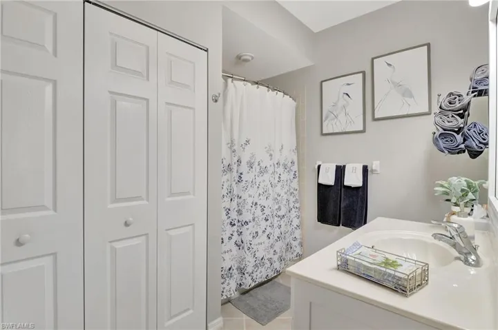Guest bath with a closet and a laundry closet