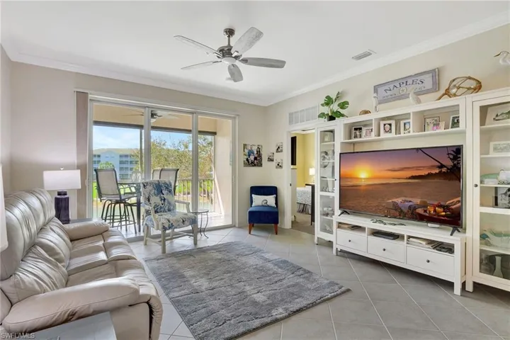 Tiled living room with crown molding