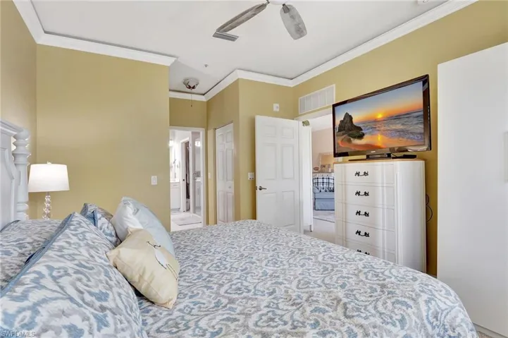Bedroom with ornamental molding, and ensuite bathroom