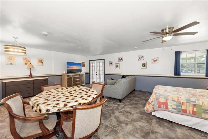 Dining area featuring ceiling fan and french doors