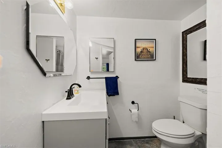 Bathroom with vanity and toilet