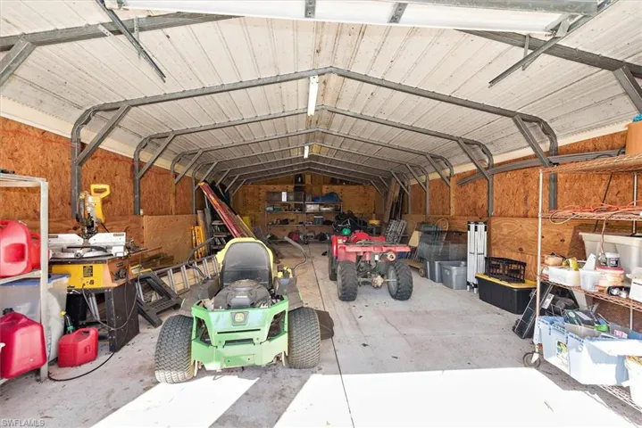 Garage featuring metal wall