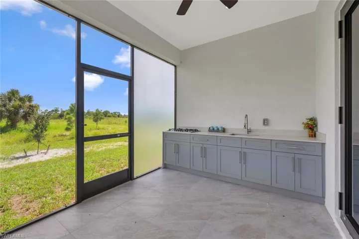 Unfurnished sunroom featuring a sink