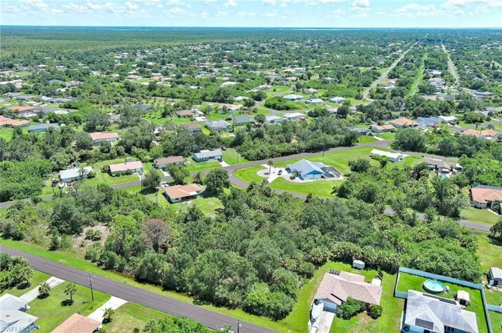 Aerial view of residential area with a tree filled landscape