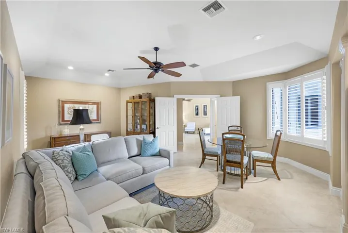 Tiled living room with ceiling fan
