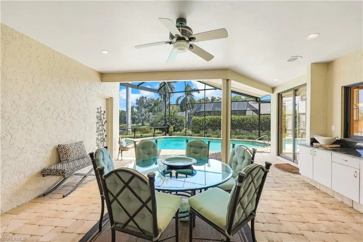 Sunroom featuring ceiling fan and lofted ceiling