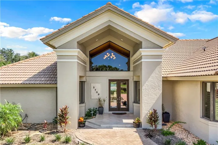 Property entrance featuring french doors