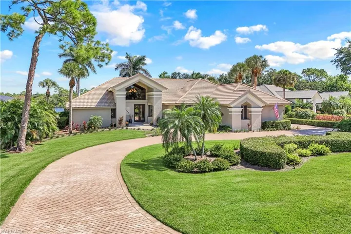 View of front of property with a front lawn
