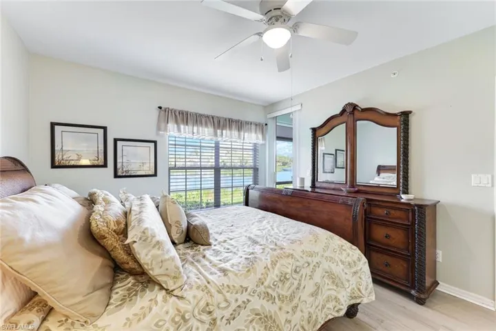 Bedroom with light wood-type flooring and a ceiling fan