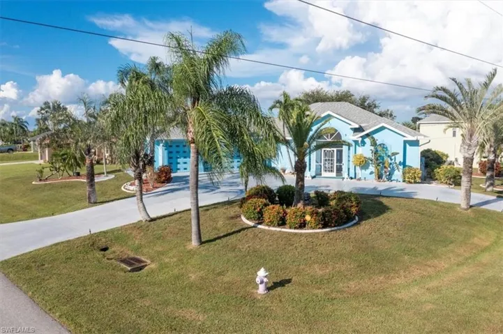 View of front of property with a front lawn