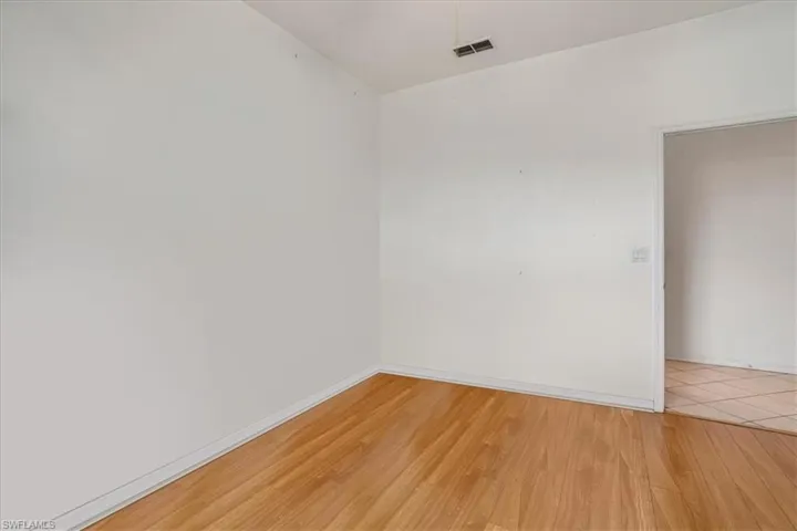 Spare room with light hardwood / wood-style floors