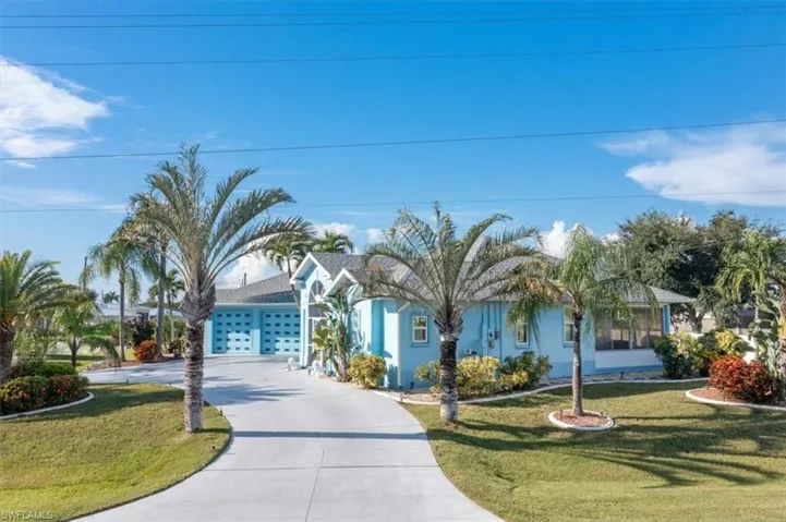 View of front facade with a garage and a front yard