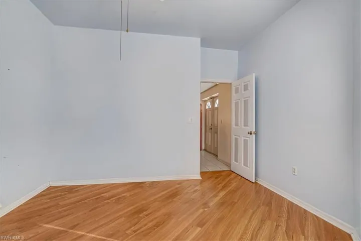 Unfurnished room with light wood-type flooring
