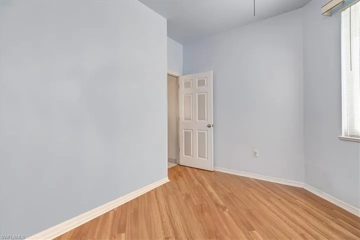 Empty room featuring a wealth of natural light and light hardwood / wood-style floors