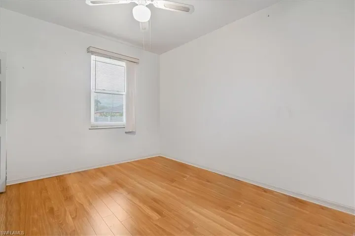 Spare room with ceiling fan and hardwood / wood-style floors
