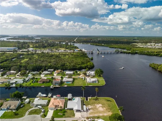 Birds eye view of property featuring a residential view and a water view