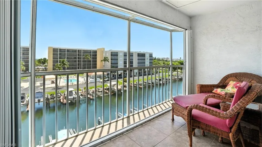 Balcony featuring a water view - Virtually Edited Image
