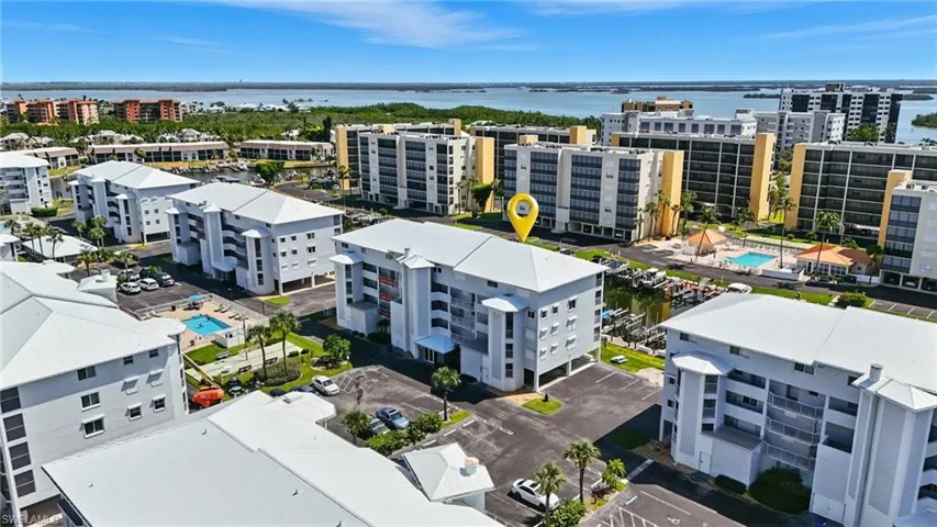 Drone / aerial view of a large body of water and a pool area - Virtually Edited Image