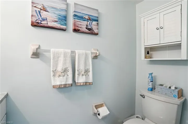 Half bathroom with toilet and vanity - Virtually Edited Image