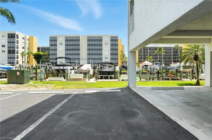 Uncovered parking lot featuring a boat dock - Virtually Edited Image