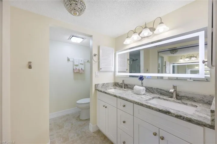 Primary Has Triple Closets, Dual Sinks, Custom Lighting Mirror, Granite