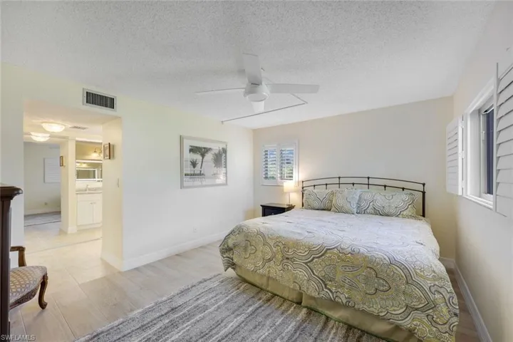 Primary Suite- Shown with a King Bed, Plantation Shutters, Great Investment Unit-12 Leases a Year!