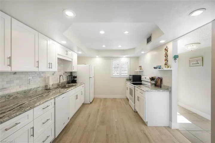 Sunny and Bright, LED Recessed Lighting in the Ceiling- Large SS Sink, Subway Tile Back Splash