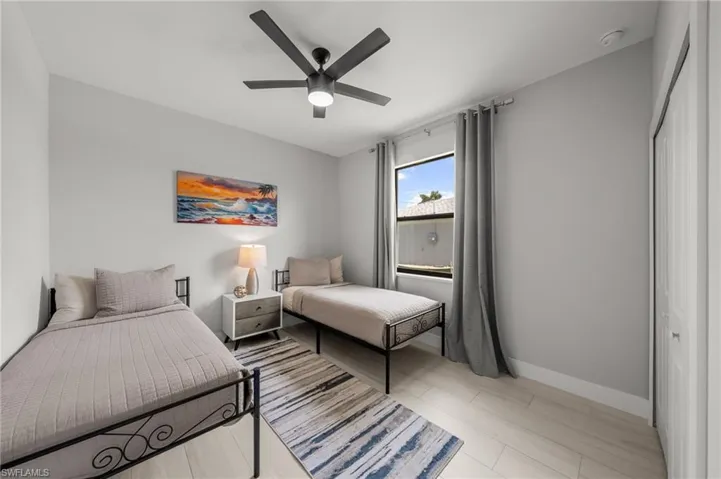 Bedroom featuring baseboards and ceiling fan