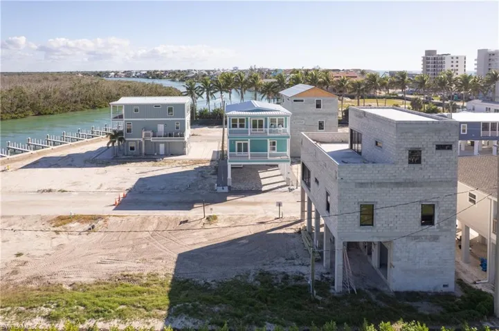 The blueish home across the street is on the market for $1,499,000.