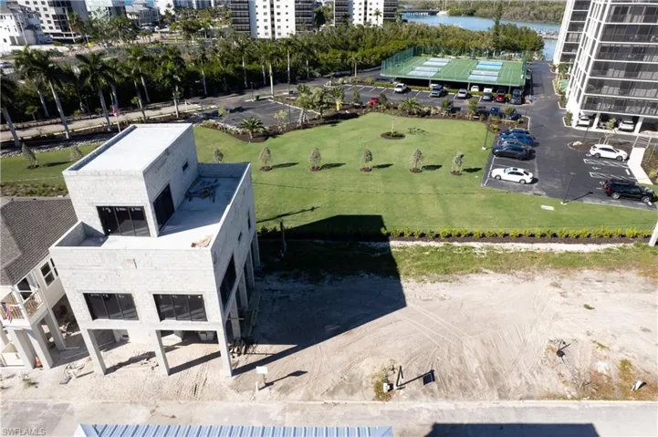 Lot #36, next to home being built with landscaped views out the back of the property.