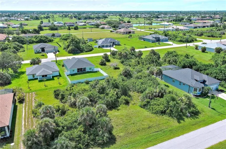 Aerial view of residential area with a large body of water
