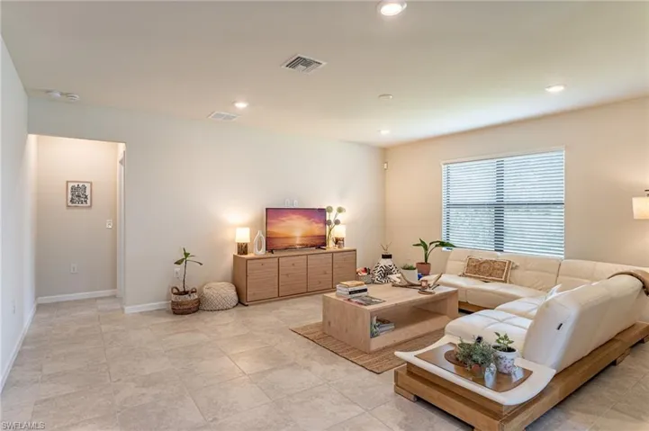 Open Living room leading to owner's suite.