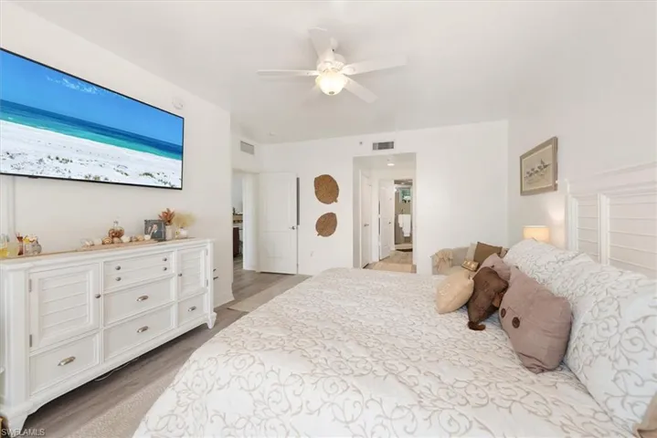 Bedroom featuring light wood-type flooring and ceiling fan