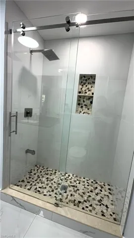 Bathroom 3 featuring a stall shower