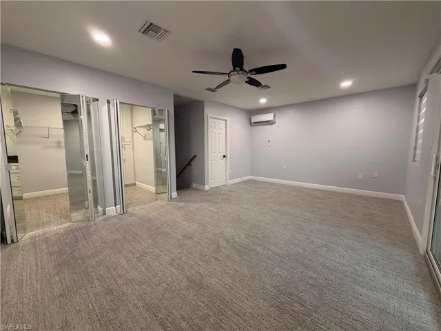 Unfurnished Master bedroom featuring recessed lighting, carpet flooring, ceiling fan, a spacious closet, and two closets