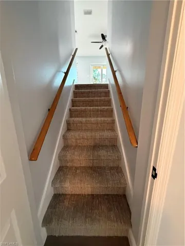 Staircase with ceiling fan to master bedroom