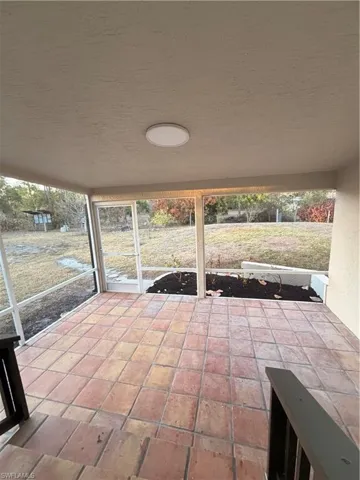 Unfurnished sunroom featuring healthy amount of natural light