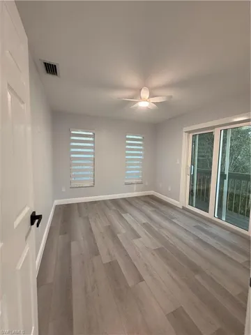 Empty room 1 featuring a ceiling fan and light wood-style floors