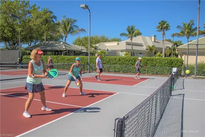 View of tennis court featuring basketball court