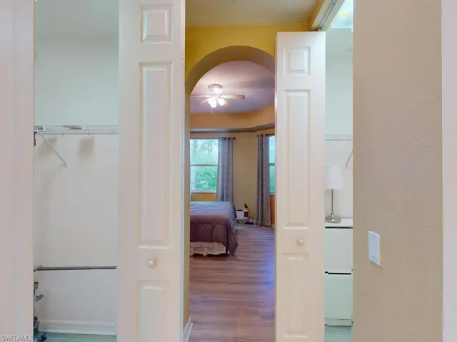 Corridor featuring hardwood / wood-style flooring