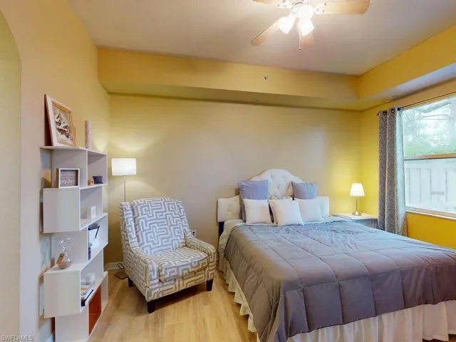 Bedroom featuring wood-type flooring and ceiling fan