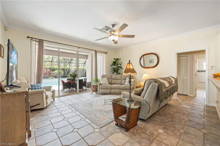 Beautiful neutral decorative tile, new fan light and crown molding through main areas.