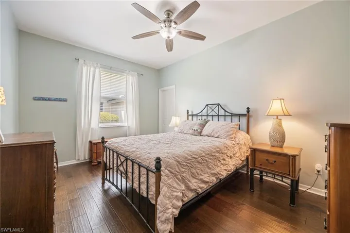 2nd bedroom with natural wood flooring. New fanlight.