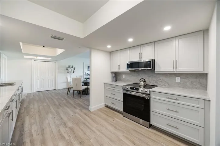 Lovely renovated kitchen with pull-out cabinetry