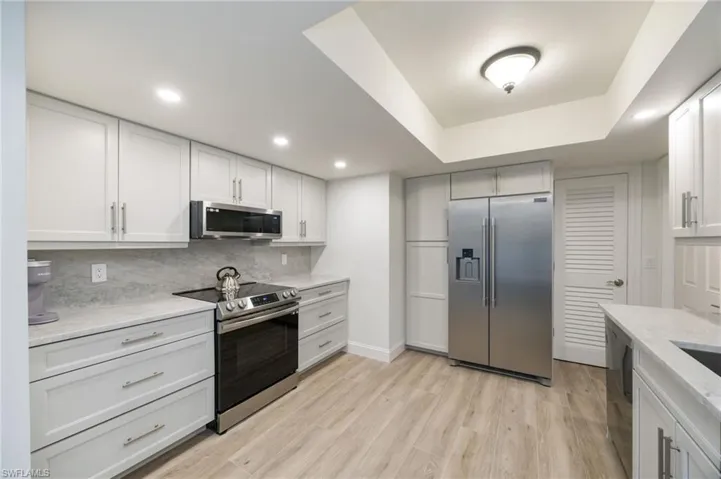 Stainless appliances and stunning white cabinetry