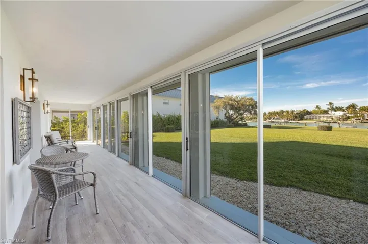 Sliding doors open directly to lawn/Bay Area.