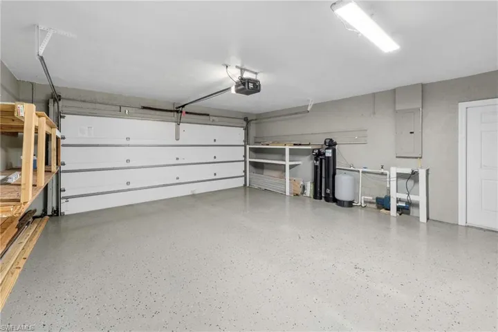 Spacious garage featuring a durable epoxy-coated concrete floor