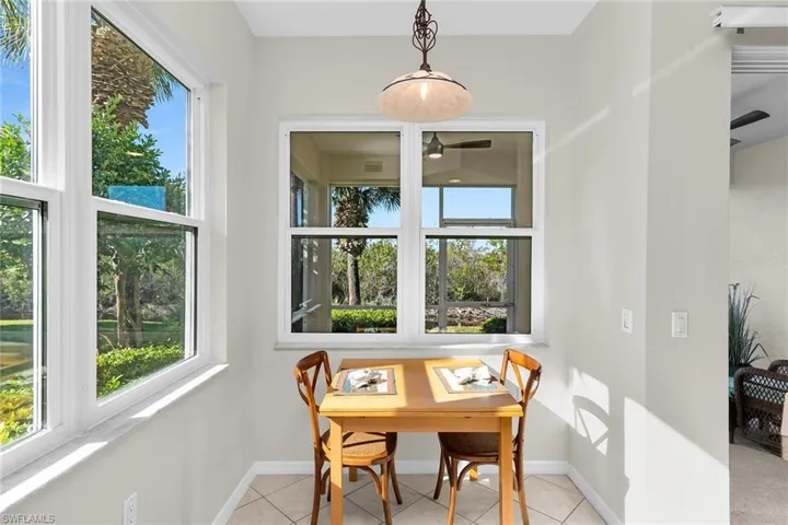 Dining area with baseboards and light tile patterned flooring